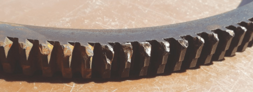 Damaged portion of starter ring removed from the flywheel