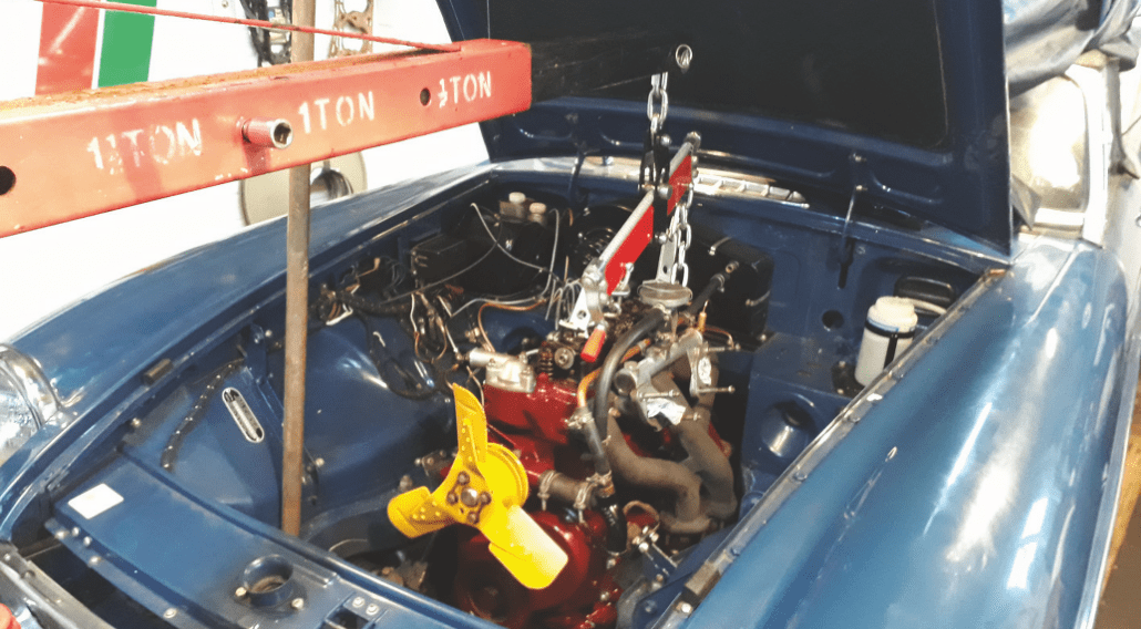 Engine being refitted to gearbox using engine crane with ‘Tilt’ attachment